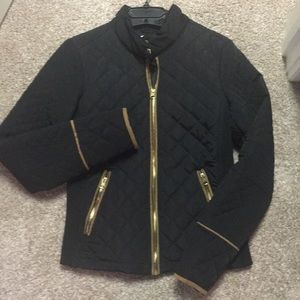 Black quilted jacket with suede zipper details